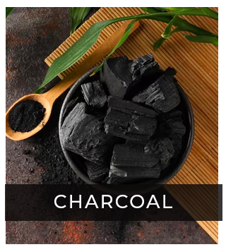 Charcoal in a bowl and powdered charcoal in spoon
