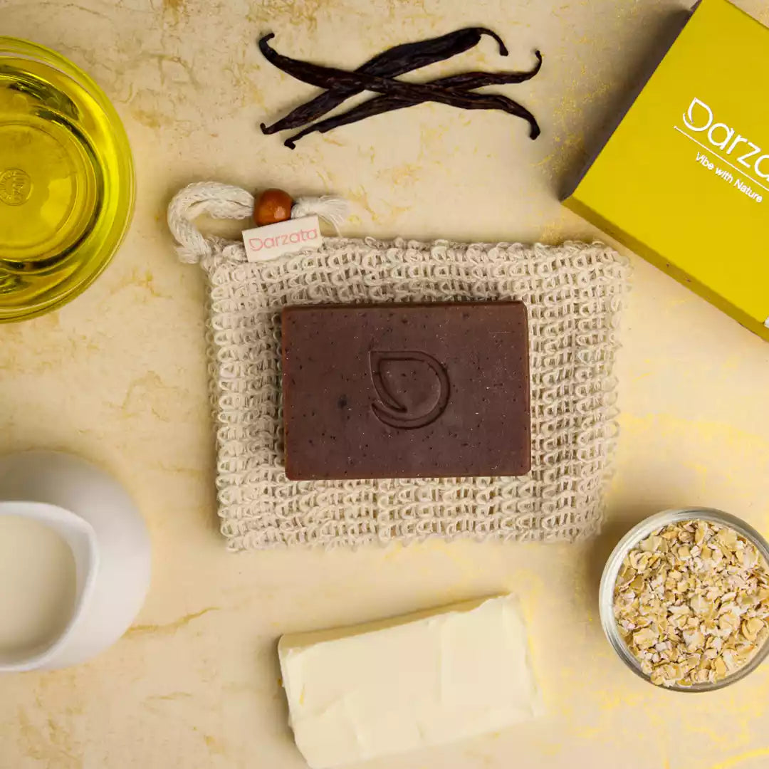 top view of almond vanilla oats soap with darzata packaging and natural ingredients