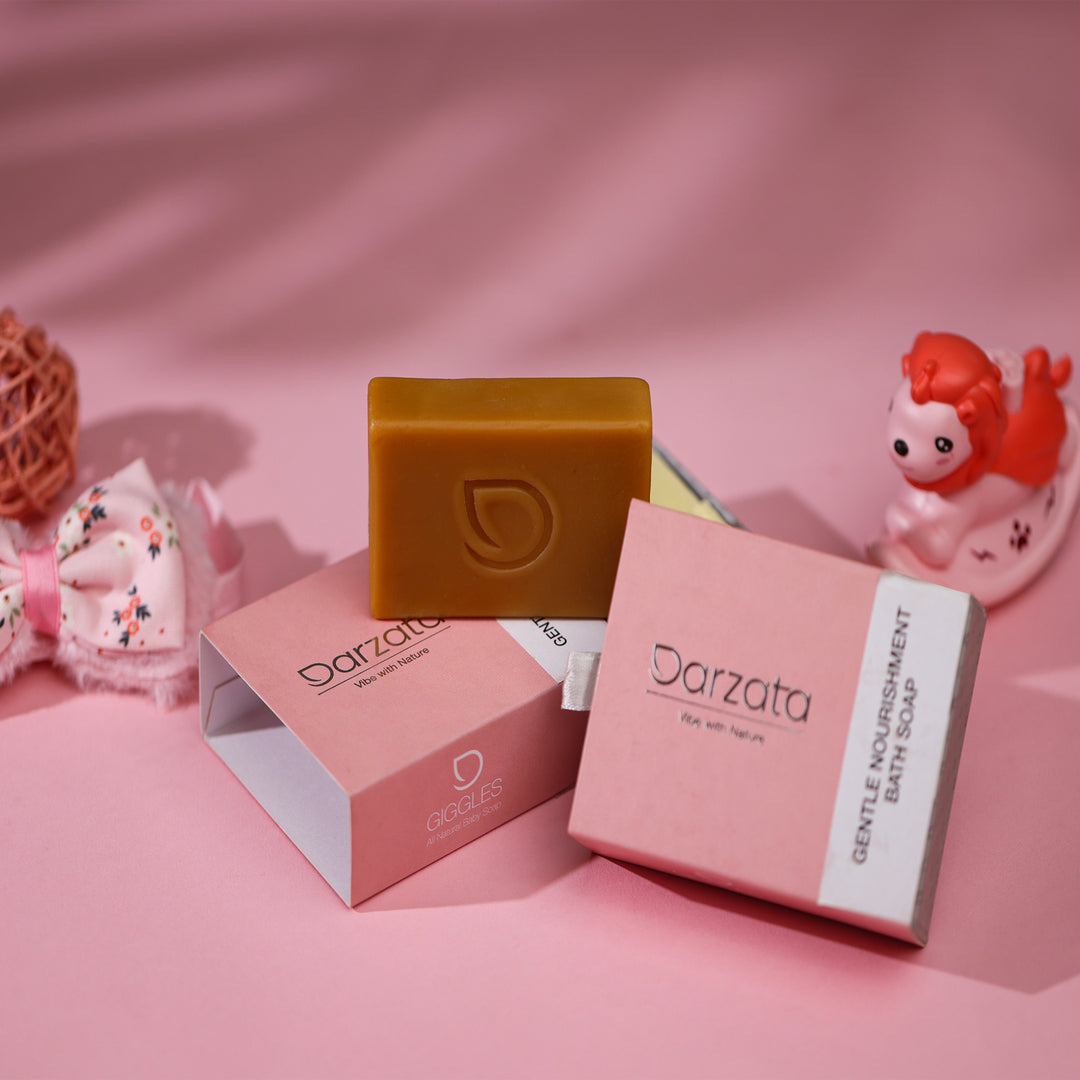 Oats baby soap kept on top of darzata packaging with baby toys