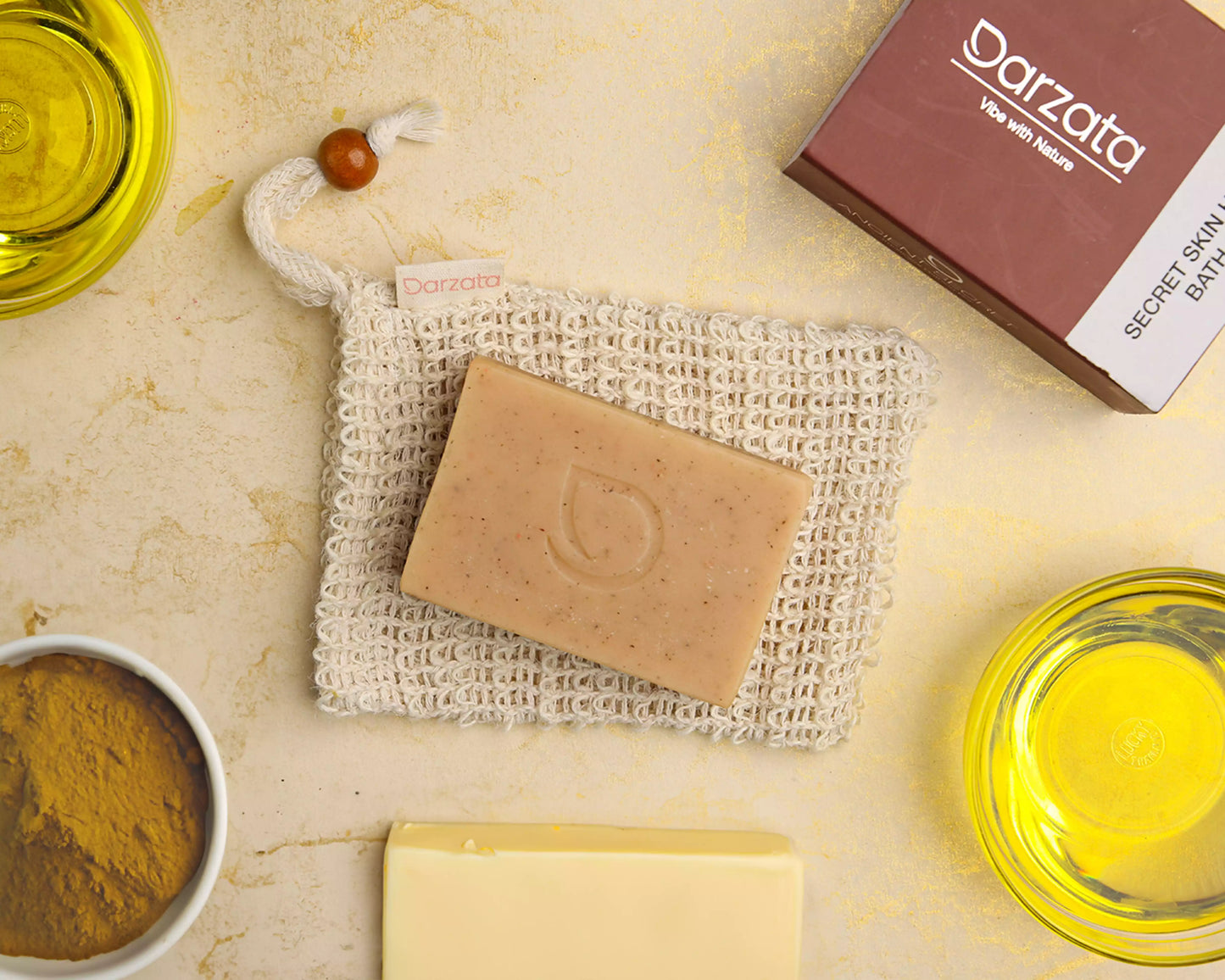 top view of sandalwood patchouli soap with darzata packaging and natural ingredients