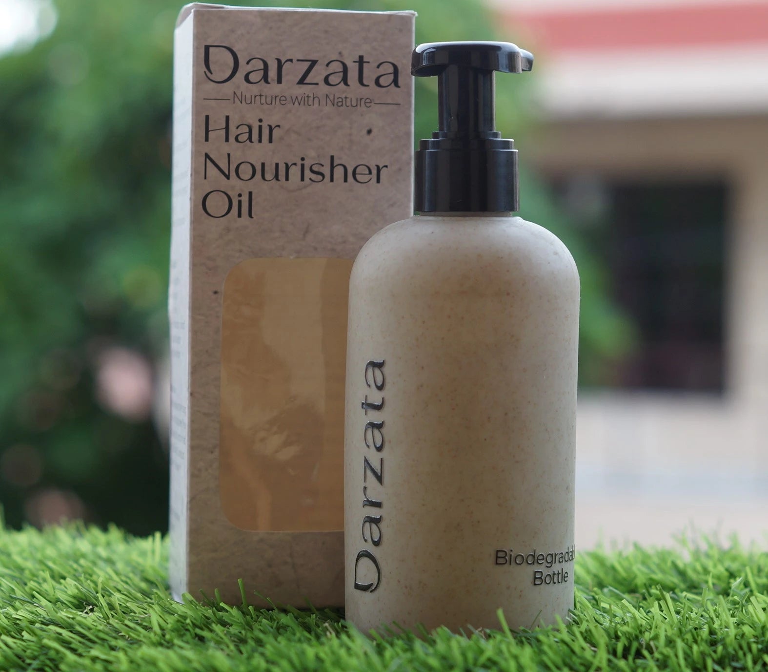 Darzata Hair Nourisher Oil bottle with its box packaging