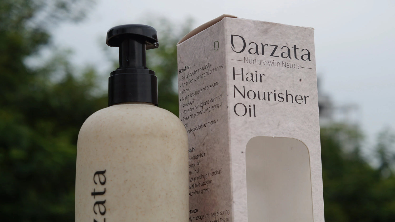 Darzata Hair Nourisher Oil bottle with its box packaging